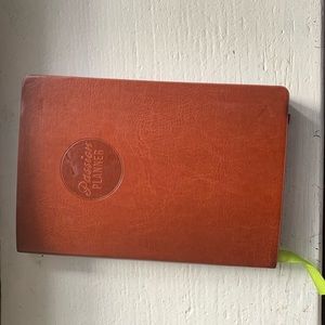 Brown small compact passion planner.